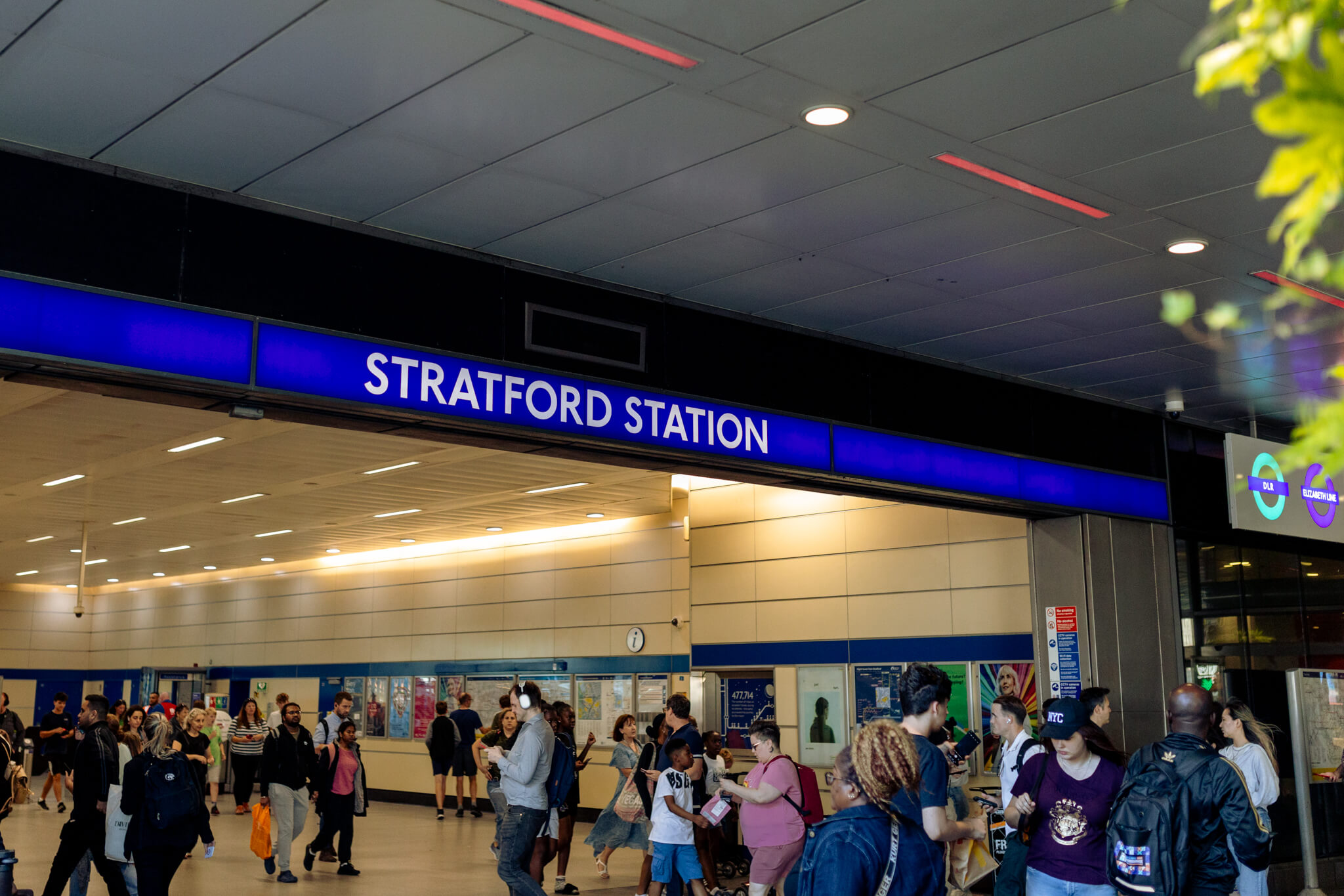 Stratford Cross station with a crowd entering.